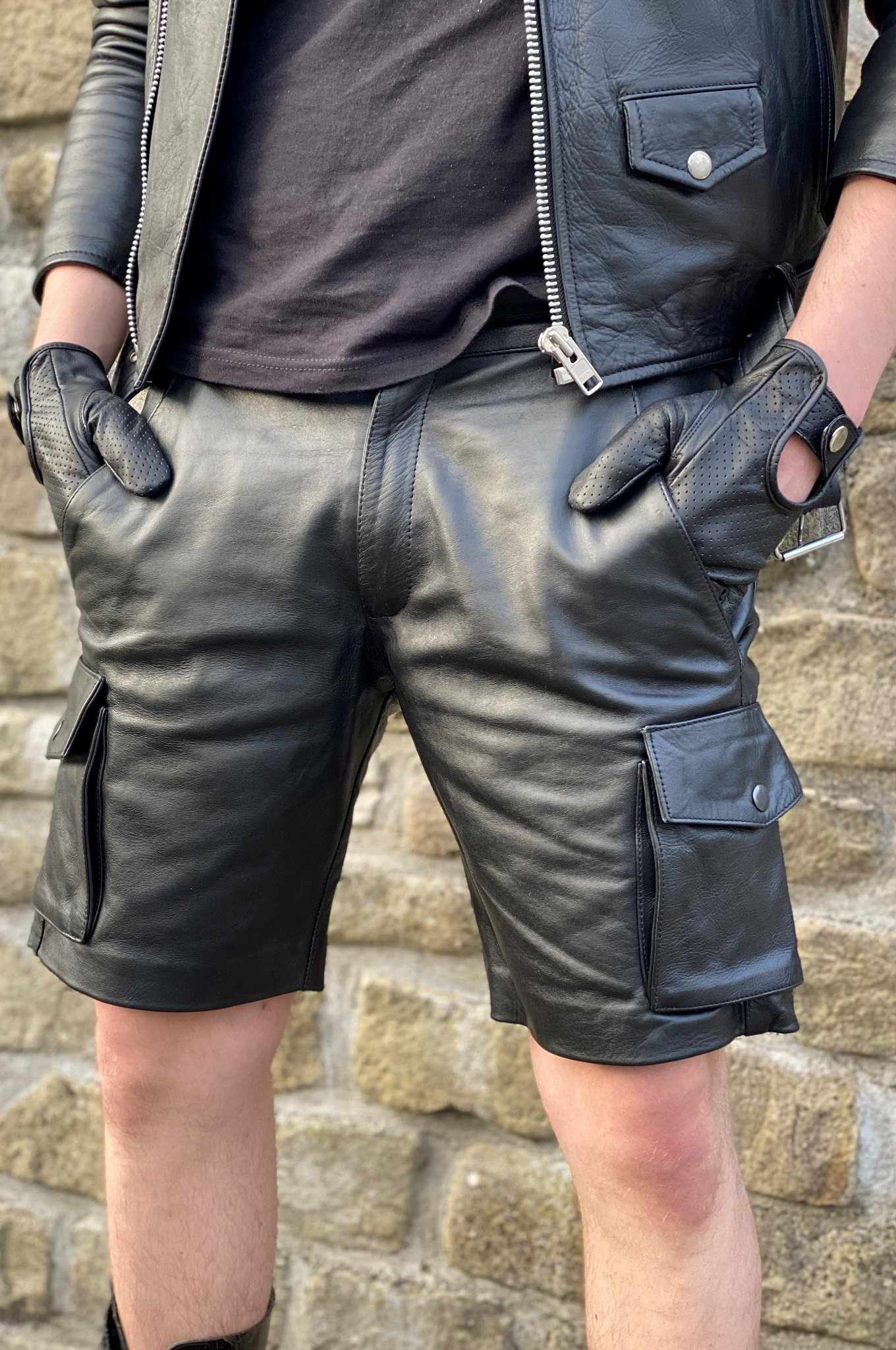Men’s leather cargo shorts collection featuring black leather cargo shorts, utility pocket details and rugged summer leather styles for bold masculine outfits.