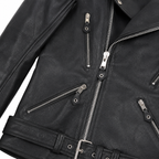 Close-up of black leather biker jacket showing silver zippers, textured leather, pocket details and waist buckle