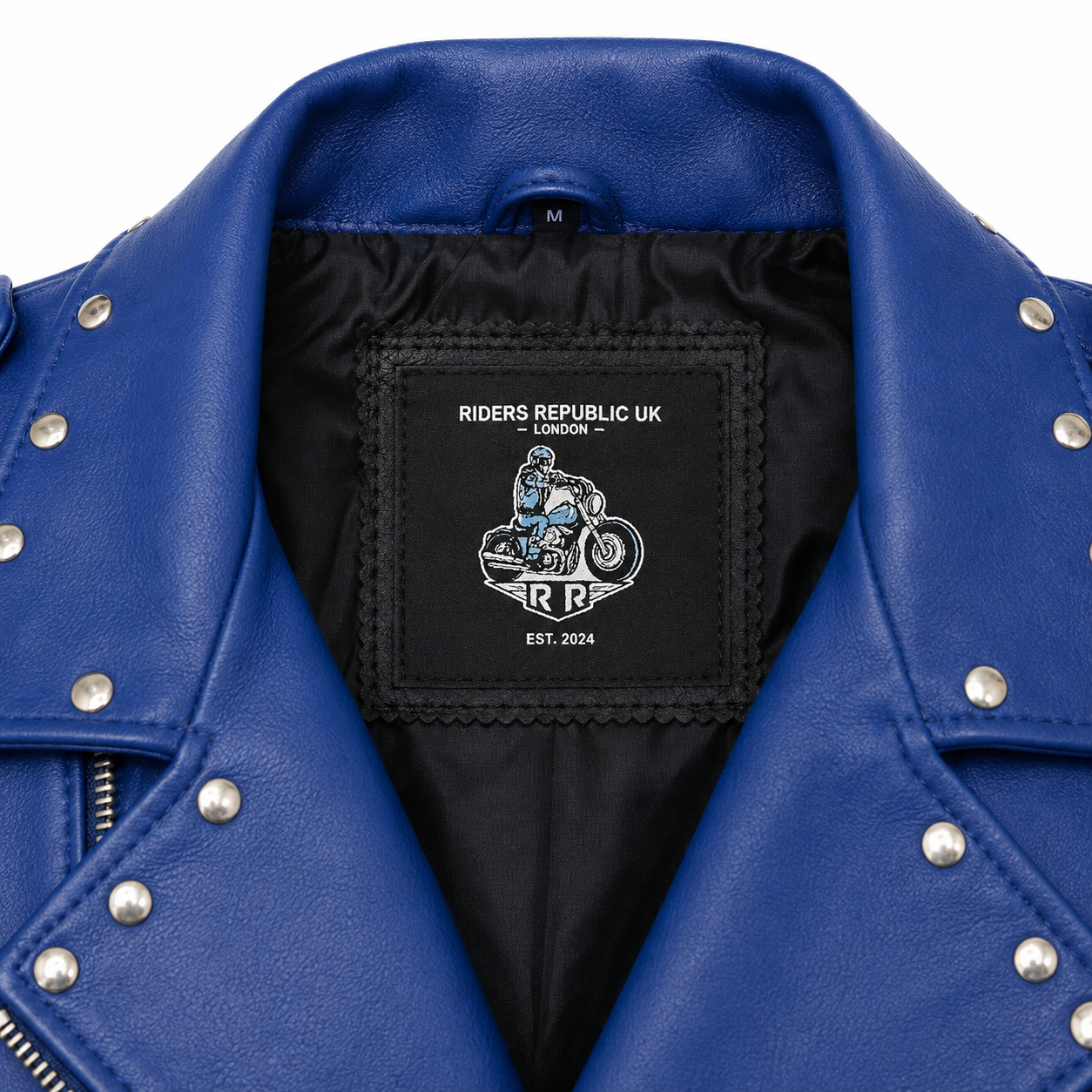 Close-up of Riders Republic UK neck label inside blue studded leather motorcycle jacket