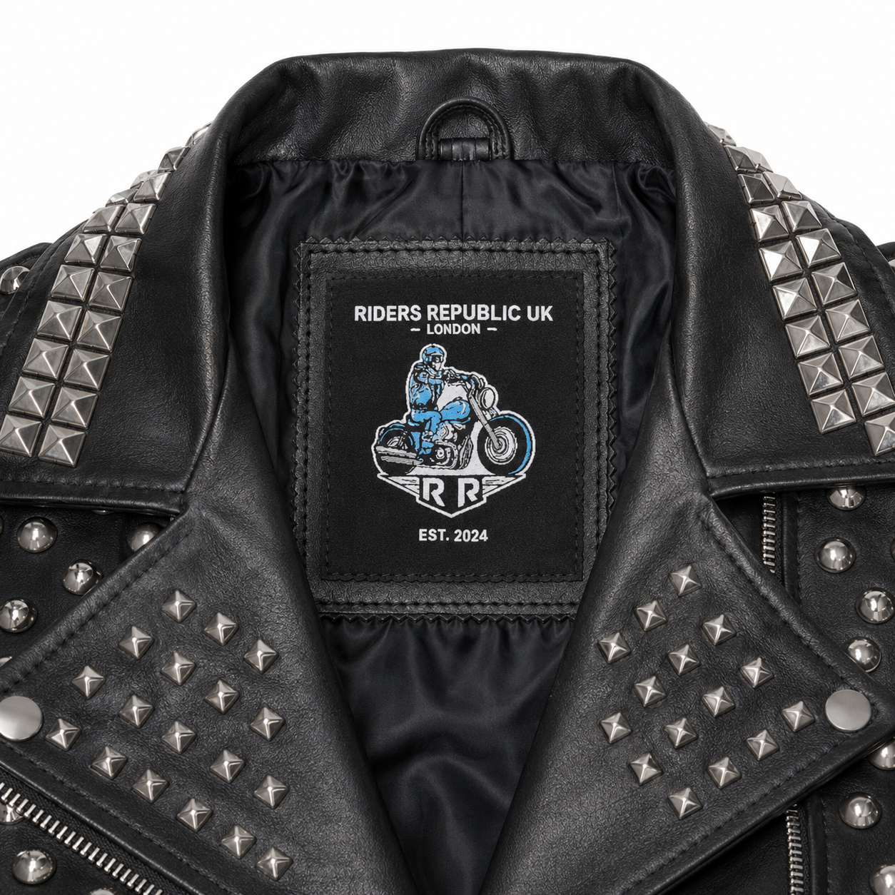 Close up of black studded leather biker jacket showing silver studs