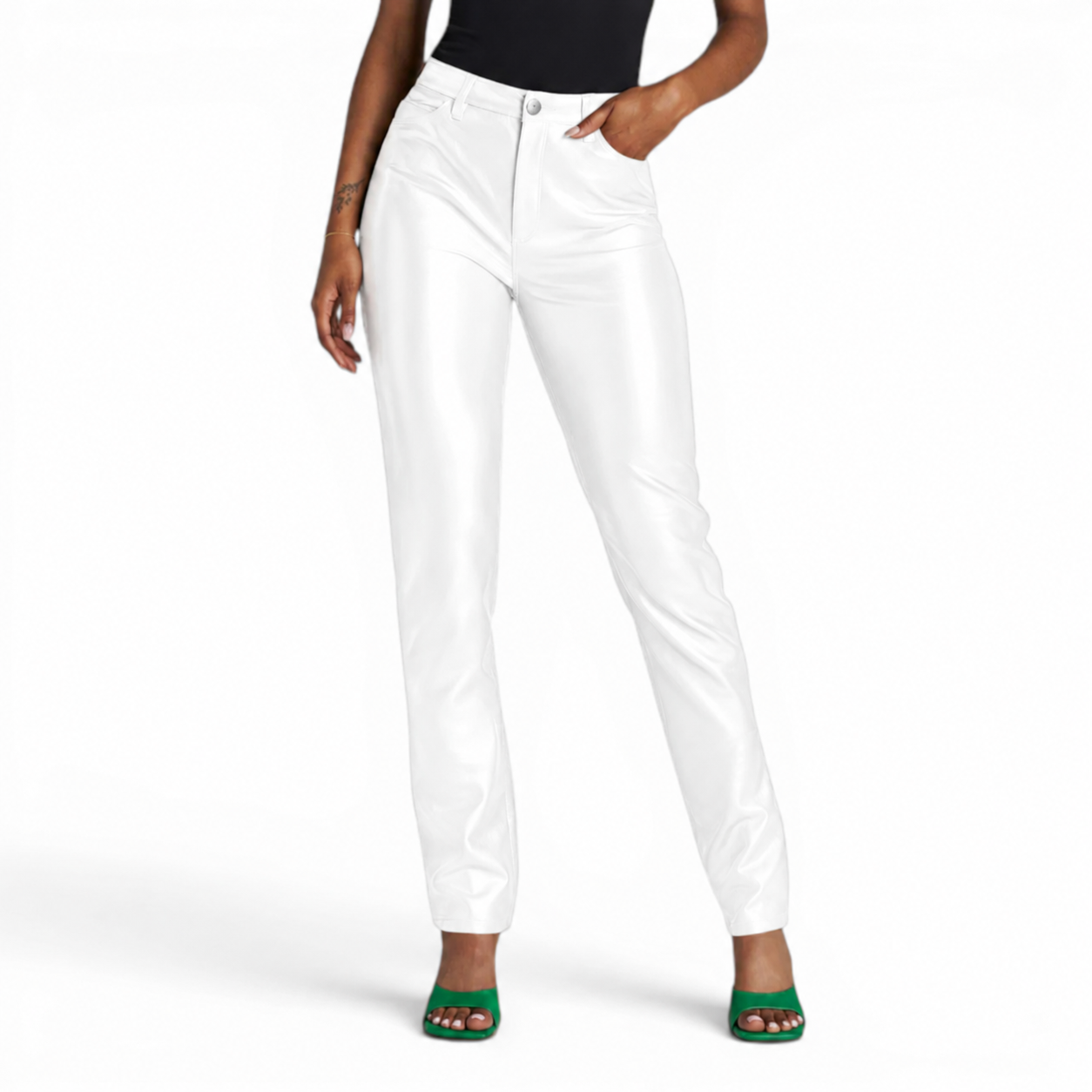 Women’s white leather pants with high waist, straight-leg fit, front pockets and glossy finish styled with a black top and green heels.