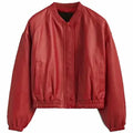 Women’s red leather bomber jacket with cropped fit, ribbed collar and button front closure.
