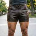 Handmade men’s brown cowhide leather shorts with mid thigh biker fit