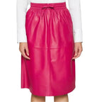 Women’s midi leather skirt in soft pink leather for smart casual and evening outfits.