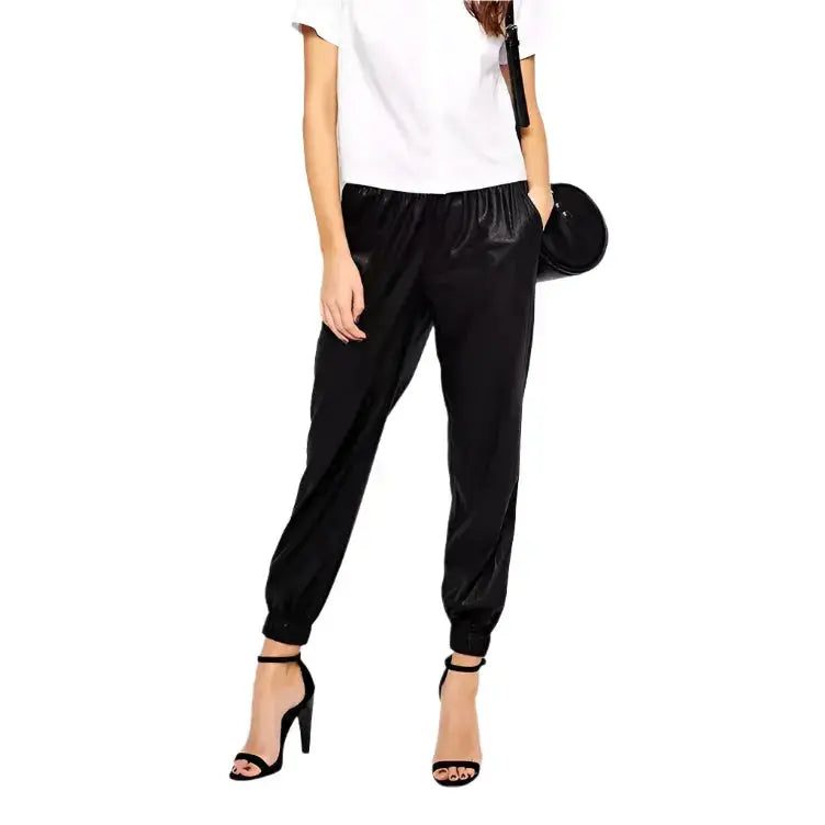 Women’s black leather joggers with relaxed fit, premium leather finish and modern streetwear pants style.