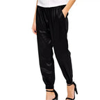 Black leather jogger pants for women with casual relaxed silhouette and stylish everyday leather look.