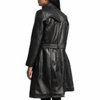 Black quilted leather coat for women with statement outerwear fit